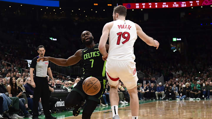 Dec 31, 2024; Boston, Massachusetts, USA; Toronto Raptors center Jakob Poeltl (19) fouls Boston Celtics guard Jaylen Brown (7) during the first half at TD Garden. Mandatory Credit: Bob DeChiara-Imagn Images Dec 31, 2024; Boston, Massachusetts, USA; Toronto Raptors center Jakob Poeltl (19) fouls Boston Celtics guard Jaylen Brown (7) during the first half at TD Garden. Mandatory Credit: Bob DeChiara-Imagn Images