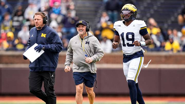 Michigan offensive coordinator Jason Beck, left, head coach Kyle Whittingham, center, and quarterback Bryce Underwood run across the field during the spring game at Michigan Stadium in Ann Arbor on Saturday, April 18, 2026. Michigan offensive coordinator Jason Beck, left, head coach Kyle Whittingham, center, and quarterback Bryce Underwood run across the field during the spring game at Michigan Stadium in Ann Arbor on Saturday, April 18, 2026.