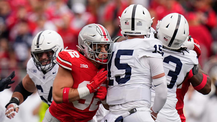 Oct 21, 2023; Columbus, Ohio, USA; Ohio State Buckeyes defensive end Caden Curry (92) hits Penn State Nittany Lions quarterback Drew Allar (15) during the NCAA football game at Ohio Stadium.