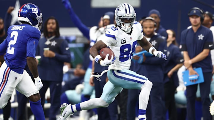 Sep 14, 2025; Arlington, Texas, USA; Dallas Cowboys wide receiver CeeDee Lamb (88) runs with the ball against the New York Giants during the second quarter at AT&T Stadium. Mandatory Credit: Kevin Jairaj-Imagn Images