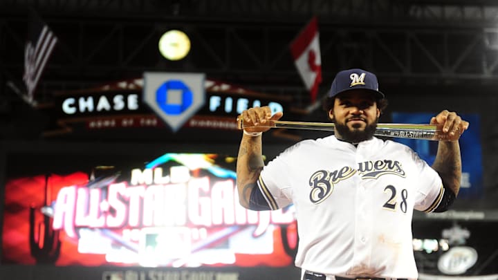 July 12, 2011; Phoenix, AZ, USA; National League first baseman Prince Fielder (28) of the Milwaukee Brewers poses for photos with the MVP trophy after defeating the American League in the 2011 All Star game at Chase Field.  Mandatory Credit: Mark J. Rebilas-Imagn Images