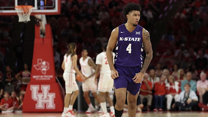 Feb 14, 2026; Houston, Texas, USA;  Kansas State Wildcats guard PJ Haggerty (4) celebrates his three point basket against the Houston Cougars in the first half at Fertitta Center. Mandatory Credit: 