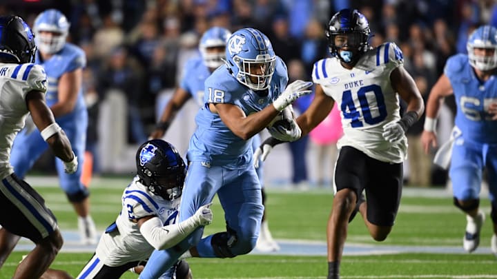 Nov 11, 2023; Chapel Hill, North Carolina, USA; North Carolina Tar Heels tight end Bryson Nesbit (18) catches the ball as Duke Blue Devils safety Jaylen Stinson (2) defends to set up a field goal attempt at the end of the fourth quarter at Kenan Memorial Stadium. Nov 11, 2023; Chapel Hill, North Carolina, USA; North Carolina Tar Heels tight end Bryson Nesbit (18) catches the ball as Duke Blue Devils safety Jaylen Stinson (2) defends to set up a field goal attempt at the end of the fourth quarter at Kenan Memorial Stadium.