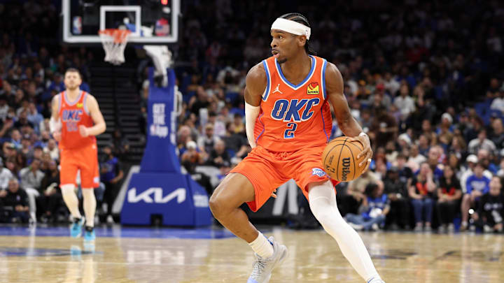 Dec 19, 2024; Orlando, Florida, USA; Oklahoma City Thunder guard Shai Gilgeous-Alexander (2) controls the ball against the Orlando Magic in the fourth quarter at Kia Center. Mandatory Credit: Nathan Ray Seebeck-Imagn Images