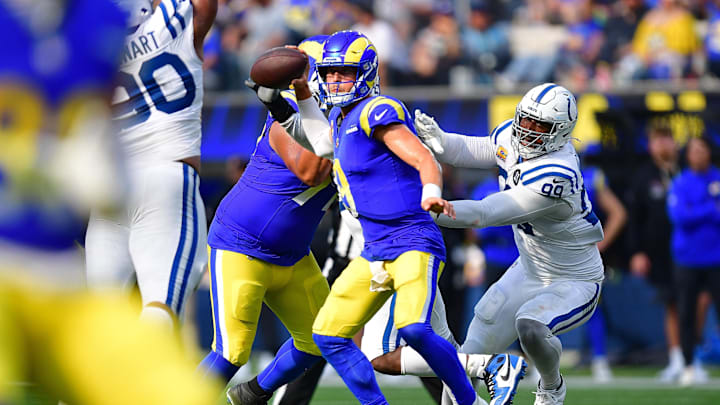 Sep 28, 2025; Inglewood, California, USA; Los Angeles Rams quarterback Matthew Stafford (9) runs out to pass as Indianapolis Colts defensive tackle Deforest Buckner (99) moves in during the second half at SoFi Stadium. Mandatory Credit: Gary A. Vasquez-Imagn Images Sep 28, 2025; Inglewood, California, USA; Los Angeles Rams quarterback Matthew Stafford (9) runs out to pass as Indianapolis Colts defensive tackle Deforest Buckner (99) moves in during the second half at SoFi Stadium. Mandatory Credit: Gary A. Vasquez-Imagn Images