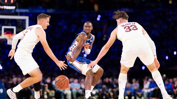 Oct 22, 2026; Philadelphia, Pennsylvania, USA; Philadelphia 76ers guard Tyrese Maxey (0) passes the ball between Cleveland Cavaliers guard Sam Merrill (5) and forward Mario Hezonja (33) during the second quarter at Xfinity Mobile Arena. Mandatory Credit: Bill Streicher-Imagn Images Oct 22, 2026; Philadelphia, Pennsylvania, USA; Philadelphia 76ers guard Tyrese Maxey (0) passes the ball between Cleveland Cavaliers guard Sam Merrill (5) and forward Mario Hezonja (33) during the second quarter at Xfinity Mobile Arena. Mandatory Credit: Bill Streicher-Imagn Images