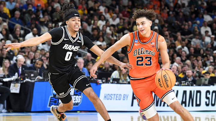 VCU Rams guard Brandon Jennings (0) defends Illinois Fighting Illini guard Keaton Wagler (23) Saturday, March 21, 2026, during the NCAA Men’s Basketball Tournament second round game at Bon Secours Wellness Arena in Greenville, South Carolina.