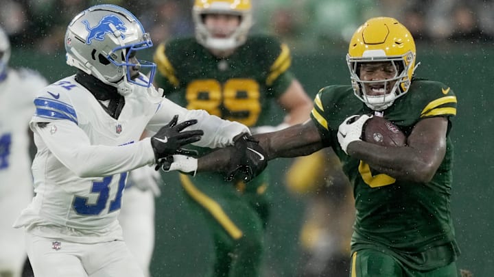 Green Bay Packers running back Josh Jacobs (8) is pursued by Detroit Lions safety Kerby Joseph. They are among the top players in the NFC North. Green Bay Packers running back Josh Jacobs (8) is pursued by Detroit Lions safety Kerby Joseph. They are among the top players in the NFC North.