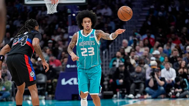 Feb 9, 2026; Charlotte, North Carolina, USA; Charlotte Hornets guard Tre Mann (23) passes the ball defended by Detroit Pistons guard Daniss Jenkins (24)during the second quarter at Spectrum Center. Mandatory Credit: Jim Dedmon-Imagn Images Feb 9, 2026; Charlotte, North Carolina, USA; Charlotte Hornets guard Tre Mann (23) passes the ball defended by Detroit Pistons guard Daniss Jenkins (24)during the second quarter at Spectrum Center. Mandatory Credit: Jim Dedmon-Imagn Images