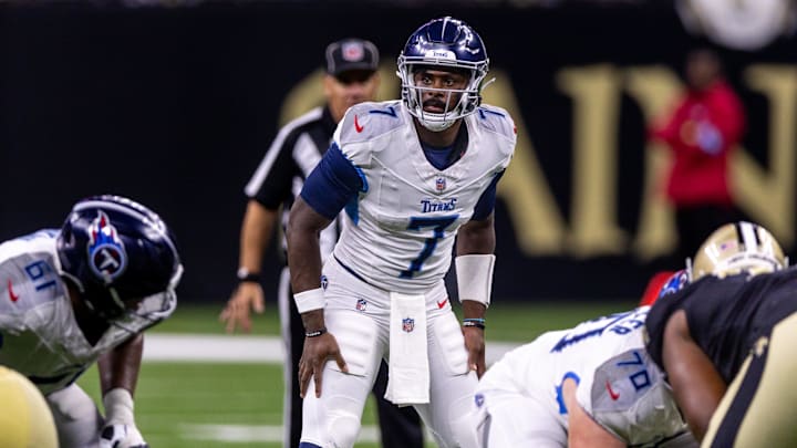 Aug 25, 2024; New Orleans, Louisiana, USA;  Tennessee Titans quarterback Malik Willis (7) looks over the New Orleans Saints defense during the second half at Caesars Superdome. Mandatory Credit: Stephen Lew-USA TODAY Sports