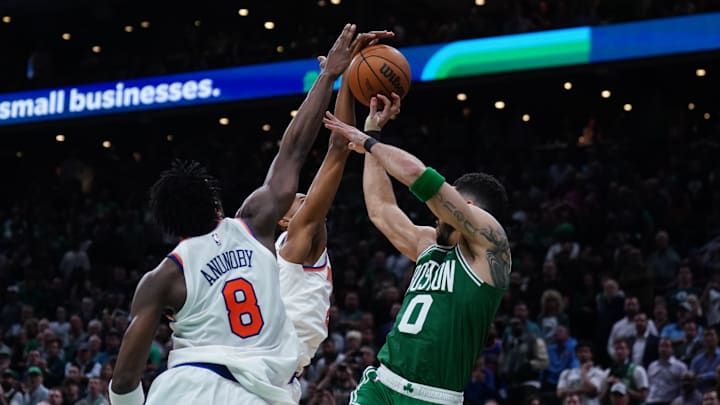 May 7, 2025; Boston, Massachusetts, USA; New York Knicks forward Mikal Bridges (25) defends against Boston Celtics forward Jayson Tatum (0) in the last seconds of the fourth quarter during game two of the second round for the 2025 NBA Playoffs at TD Garden. Mandatory Credit: David Butler II-Imagn Images