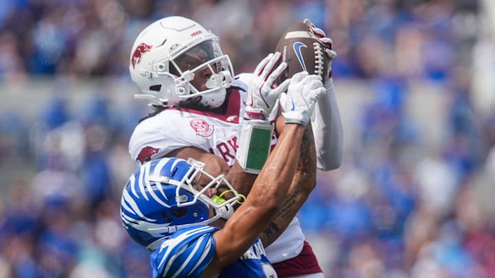 Memphis' Marcello Bussey (6) has the ball pulled out of his hands by Arkansas' Julian Neal (23) during the game between Memphis and Arkansas at Simmons Bank Liberty Stadium in Memphis, Tenn., on September 20, 2025.