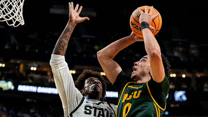Michigan State forward Coen Carr (55) blocks North Dakota State guard Trevian Carson (0) during the first half of NCAA Tournament First Round at KeyBank Center in Buffalo on Thursday, March 19, 2026.