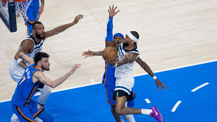 May 22, 2025; Oklahoma City, Oklahoma, USA; Minnesota Timberwolves guard Nickeil Alexander-Walker (9) shoots against Oklahoma City Thunder guard Shai Gilgeous-Alexander (2) and forward Chet Holmgren (7) in the third quarter during game two of the western conference finals for the 2025 NBA Playoffs at Paycom Center. Mandatory Credit: Brett Rojo-Imagn Images May 22, 2025; Oklahoma City, Oklahoma, USA; Minnesota Timberwolves guard Nickeil Alexander-Walker (9) shoots against Oklahoma City Thunder guard Shai Gilgeous-Alexander (2) and forward Chet Holmgren (7) in the third quarter during game two of the western conference finals for the 2025 NBA Playoffs at Paycom Center. Mandatory Credit: Brett Rojo-Imagn Images