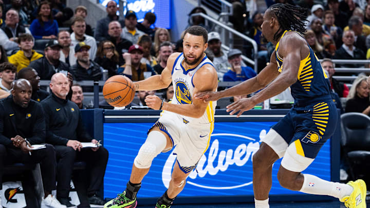 Nov 1, 2025; Indianapolis, Indiana, USA: Golden State Warriors guard Stephen Curry (30) dribbles the ball while Indiana Pacers guard/forward Aaron Nesmith (23) defends in the first half at Gainbridge Fieldhouse. Mandatory Credit: Trevor Ruszkowski-Imagn Images Nov 1, 2025; Indianapolis, Indiana, USA: Golden State Warriors guard Stephen Curry (30) dribbles the ball while Indiana Pacers guard/forward Aaron Nesmith (23) defends in the first half at Gainbridge Fieldhouse. Mandatory Credit: Trevor Ruszkowski-Imagn Images