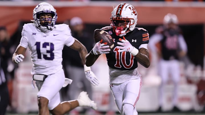 Oct 19, 2024; Salt Lake City, Utah, USA; Utah Utes wide receiver Money Parks (10) makes a touchdown catch against TCU Horned Frogs cornerback JaTravis Broughton (13) during the third quarter at Rice-Eccles Stadium.