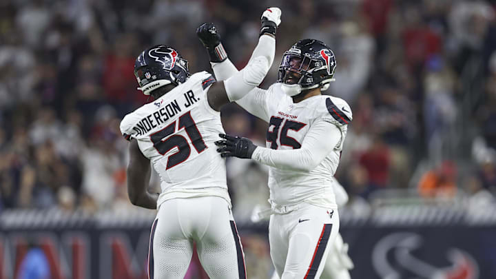 Sep 15, 2024; Houston, Texas, USA; Houston Texans defensive end Derek Barnett (95) celebrates with defensive end Will Anderson Jr. (51) after a sack during the second quarter against the Chicago Bears at NRG Stadium. Mandatory Credit: Troy Taormina-Imagn Images