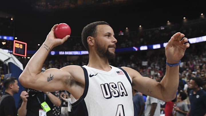 Jul 10, 2024; Las Vegas, Nevada, USA; USA guard Steph Curry (4) throws a ball to the fans after defeating Canada in the USA Basketball Showcase at T-Mobile Arena. Mandatory Credit: Candice Ward-Imagn Images