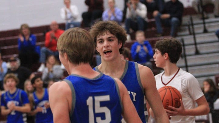 Olentangy Liberty's Tyler Kropp celebrates Parker Van Engelenhoven's basket against Newark during the visiting Patriots' 58-49 victory at Jimmy Allen Gymnasium on Tuesday, Dec. 19, 2023. Olentangy Liberty's Tyler Kropp celebrates Parker Van Engelenhoven's basket against Newark during the visiting Patriots' 58-49 victory at Jimmy Allen Gymnasium on Tuesday, Dec. 19, 2023.