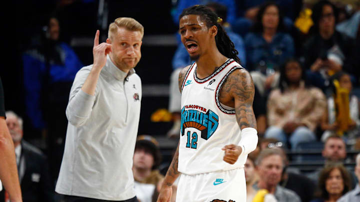 Apr 18, 2025; Memphis, Tennessee, USA; Memphis Grizzlies interim head coach Tuomas Iisalo and Memphis Grizzlies guard Ja Morant (12) react after a foul call during the fourth quarter against the Dallas Mavericks at FedExForum. Mandatory Credit: Petre Thomas-Imagn Images