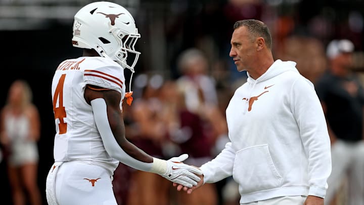 Texas Longhorns head coach Steve Sarkisian talks with running back CJ Baxter Jr. (4), Oct. 25, 2025 at Davis Wade Stadium at Scott Field in Starkville, Mississippi. Texas Longhorns head coach Steve Sarkisian talks with running back CJ Baxter Jr. (4), Oct. 25, 2025 at Davis Wade Stadium at Scott Field in Starkville, Mississippi.
