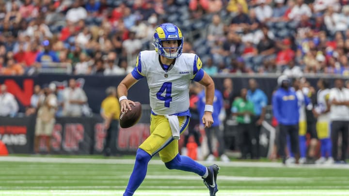 Aug 24, 2024; Houston, Texas, USA; Los Angeles Rams quarterback Dresser Winn (4) scrambles against the Houston Texans in the second quarter at NRG Stadium. Mandatory Credit: Thomas Shea-USA TODAY Sports Aug 24, 2024; Houston, Texas, USA; Los Angeles Rams quarterback Dresser Winn (4) scrambles against the Houston Texans in the second quarter at NRG Stadium. Mandatory Credit: Thomas Shea-USA TODAY Sports