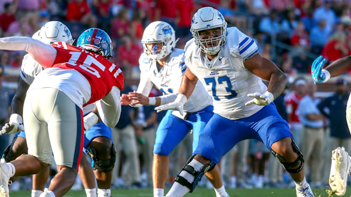 Sep 7, 2024; Oxford, Mississippi, USA; Middle Tennessee Blue Raiders offensive linemen Marcus Miller (73) blocks during the second half against the Mississippi Rebels at Vaught-Hemingway Stadium. Mandatory Credit: Petre Thomas-Imagn Images