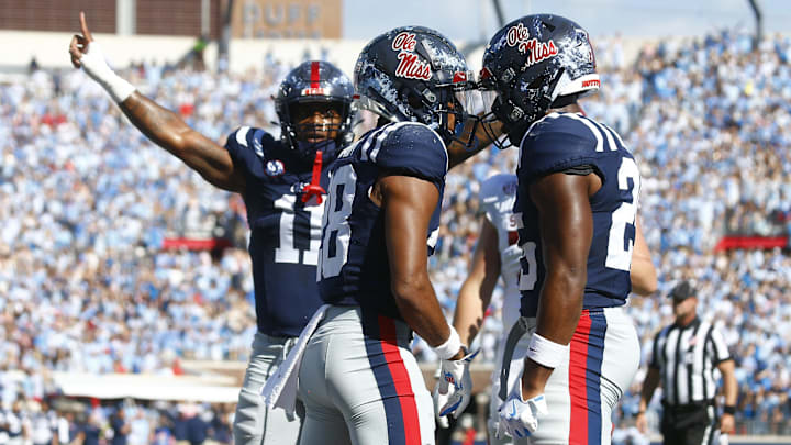 Oct 26, 2024; Oxford, Mississippi, USA; Mississippi Rebels defensive back Jadon Canady (28) reacts with defensive back Trey Washington (25) after a fourth down stop during the first half against the Oklahoma Sooners at Vaught-Hemingway Stadium. Mandatory Credit: Petre Thomas-Imagn Images Oct 26, 2024; Oxford, Mississippi, USA; Mississippi Rebels defensive back Jadon Canady (28) reacts with defensive back Trey Washington (25) after a fourth down stop during the first half against the Oklahoma Sooners at Vaught-Hemingway Stadium. Mandatory Credit: Petre Thomas-Imagn Images