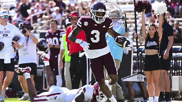 Oct 26, 2024; Starkville, Mississippi, USA; Mississippi State Bulldogs wide receiver Kevin Coleman Jr. (3) runs for a touchdown while defended by Arkansas Razorbacks defensive back Doneiko Slaughter (3) during the third quarter at Davis Wade Stadium at Scott Field. Mandatory Credit: Matt Bush-Imagn Images