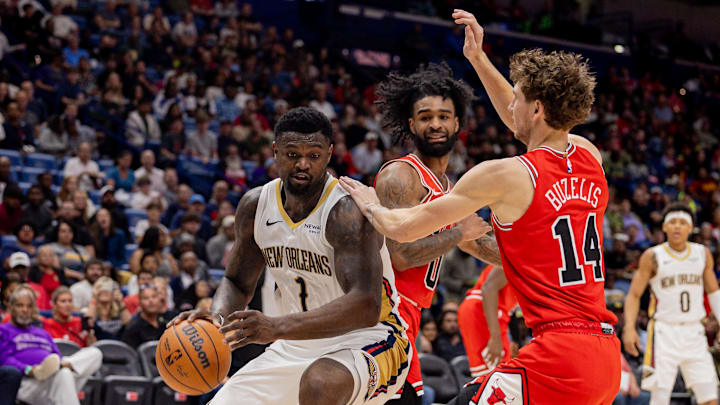 Nov 24, 2025; New Orleans, Louisiana, USA;  New Orleans Pelicans forward Zion Williamson (1) dribbles against Chicago Bulls forward Matas Buzelis (14) during the first half at Smoothie King Center. Mandatory Credit: Stephen Lew-Imagn Images