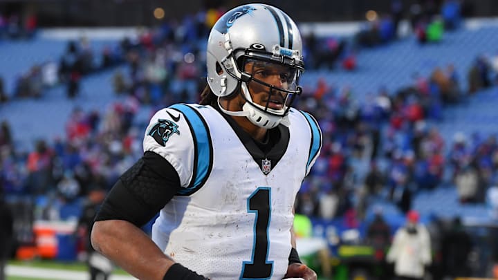 Dec 19, 2021; Orchard Park, New York, USA; Carolina Panthers quarterback Cam Newton (1) jogs off the field following the game against the Buffalo Bills at Highmark Stadium. Mandatory Credit: Rich Barnes-Imagn Images