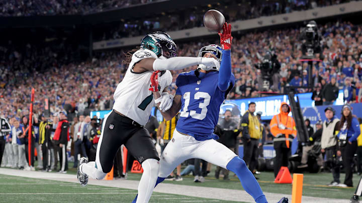 Oct 9, 2025; East Rutherford, New Jersey, USA; New York Giants wide receiver Jalin Hyatt (13) can't catch a pass in the end zone against Philadelphia Eagles cornerback Kelee Ringo (7) during the fourth quarter at MetLife Stadium. Ringo was called for pass interference on the play. 