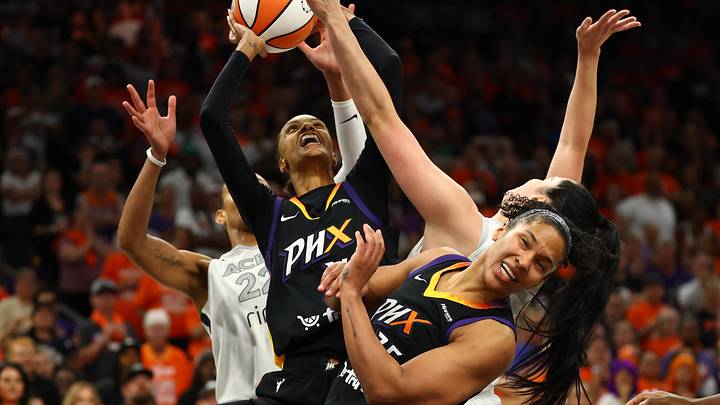 Oct 8, 2025; Phoenix, Arizona, USA; Phoenix Mercury forward DeWanna Bonner (14) shoots the ball over Las Vegas Aces center A'ja Wilson (22) in the second half during game three of the 2025 WNBA Finals at PHX Arena. Mandatory Credit: Mark J. Rebilas-Imagn Images
