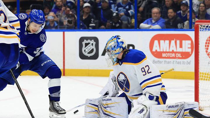 Feb 3, 2026; Tampa, Florida, USA; Tampa Bay Lightning center Yanni Gourde (37) shoots as Buffalo Sabres goaltender Colten Ellis (92) defends during the third period at Benchmark International Arena. Mandatory Credit: Kim Klement Neitzel-Imagn Images
