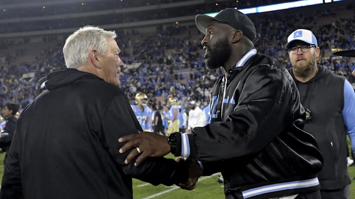 Nov 8, 2024; Pasadena, California, USA;  Iowa Hawkeyes head coach Kirk Ferentz, left,  shakes hands with UCLA Bruins head coach DeShaun Foster following the game at the Rose Bowl. Mandatory Credit: Jayne Kamin-Oncea-Imagn Images