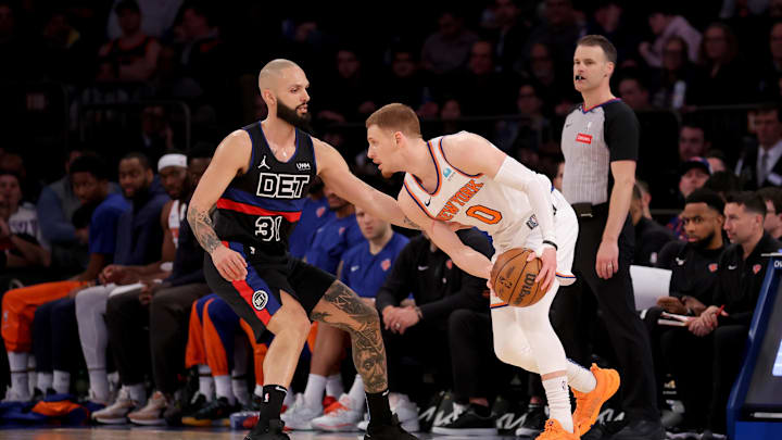 Mar 25, 2024; New York, New York, USA; New York Knicks guard Donte DiVincenzo (0) controls the ball against Detroit Pistons guard Evan Fournier (31) during the fourth quarter at Madison Square Garden. Mandatory Credit: Brad Penner-Imagn Images