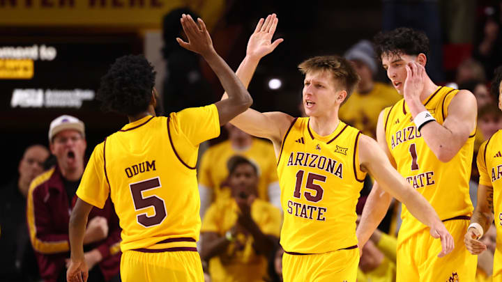 Jan 24, 2026; Tempe, Arizona, USA; Arizona State Sun Devils guard Maurice Odum (5) celebrates with teammate Noah Meeusen (15) against the Cincinnati Bearcats in the first half at Desert Financial Arena. Mandatory Credit: Mark J. Rebilas-Imagn Images