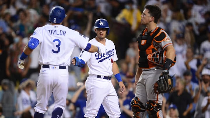 Jul 20, 2021; Los Angeles, California, USA; Los Angeles Dodgers shortstop Chris Taylor (3) is greeted by catcher Austin Barnes (15) after hitting a two run home run against the San Francisco Giants during the sixth inning at Dodger Stadium. Mandatory Credit: Gary A. Vasquez-Imagn Images