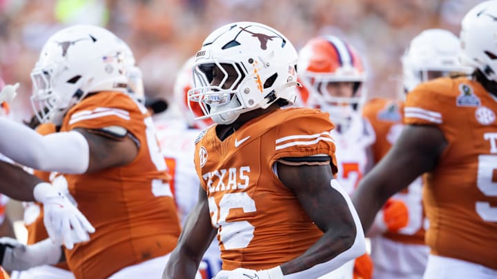 Dec 21, 2024; Austin, Texas, USA; Texas Longhorns running back Quintrevion Wisner (26) celebrates after scoring a touchdown against the Clemson Tigers during the first half of the CFP National playoff first round at Darrell K Royal-Texas Memorial Stadium. Mandatory Credit: Mark J. Rebilas-Imagn Imagesn Images
