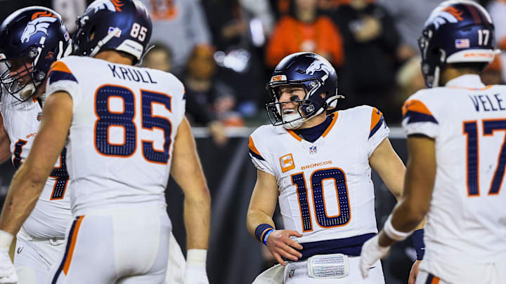 Dec 28, 2024; Cincinnati, Ohio, USA; Denver Broncos quarterback Bo Nix (10) reacts after a touchdown is scored in the second half against the Cincinnati Bengals at Paycor Stadium. 