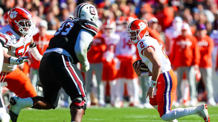 Nov 29, 2025; Columbia, South Carolina, USA; Clemson Tigers quarterback Cade Klubnik (2) scrambles against the South Carolina Gamecocks in the second quarter at Williams-Brice Stadium. Mandatory Credit: Jeff Blake-Imagn Images