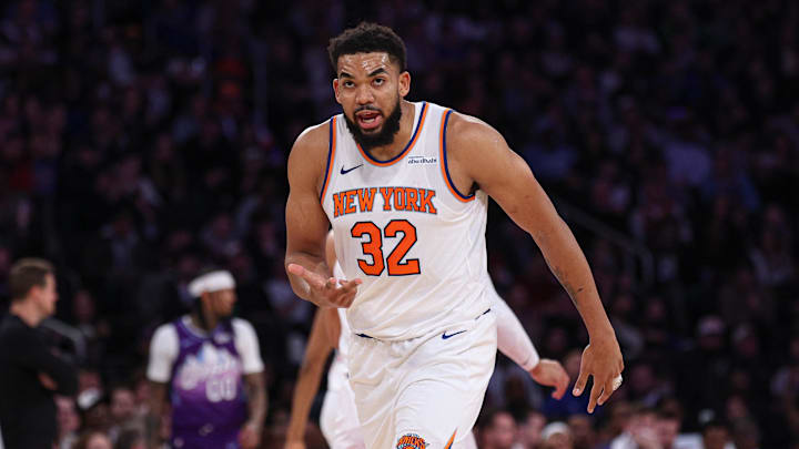 Jan 1, 2025; New York, New York, USA; New York Knicks center Karl-Anthony Towns (32) reacts after makes a three point basket during the first half against the Utah Jazz at Madison Square Garden. Mandatory Credit: Vincent Carchietta-Imagn Images