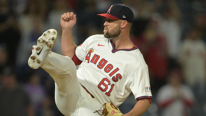 Jul 30, 2024; Anaheim, California, USA; Los Angeles Angels relief pitcher Hunter Strickland (61) earns a save in the ninth inning against the Colorado Rockies at Angel Stadium. Mandatory Credit: Jayne Kamin-Oncea-Imagn Images