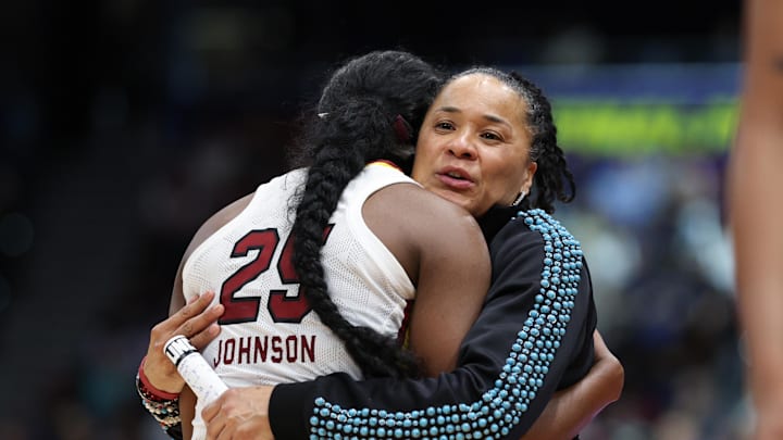 Apr 6, 2025; Tampa, FL, USA; South Carolina Gamecocks head coach Dawn Staley hugs guard Raven Johnson (25) during the second half of the national championship of the women's 2025 NCAA tournament at Amalie Arena. Mandatory Credit: Nathan Ray Seebeck-Imagn Images Apr 6, 2025; Tampa, FL, USA; South Carolina Gamecocks head coach Dawn Staley hugs guard Raven Johnson (25) during the second half of the national championship of the women's 2025 NCAA tournament at Amalie Arena. Mandatory Credit: Nathan Ray Seebeck-Imagn Images