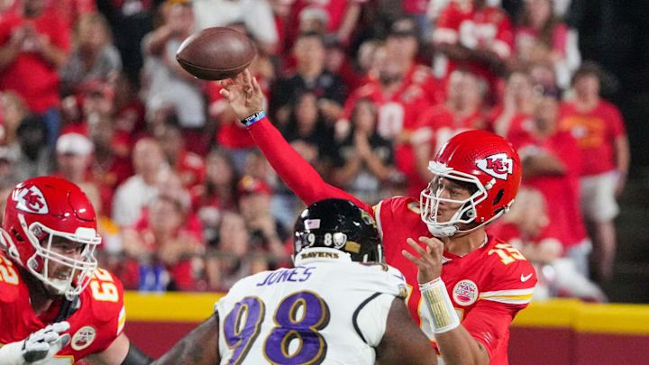 Sep 5, 2024; Kansas City, Missouri, USA; Kansas City Chiefs quarterback Patrick Mahomes (15) throws a pass as Baltimore Ravens defensive tackle Travis Jones (98) defends during the first half at GEHA Field at Arrowhead Stadium. Mandatory Credit: Denny Medley-Imagn Images