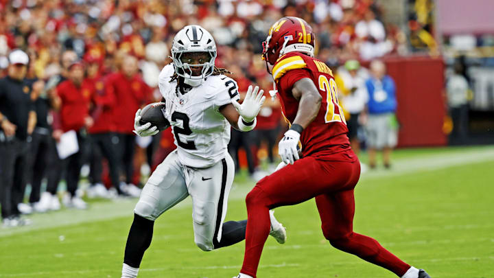 Sep 21, 2025; Landover, Maryland, USA; Las Vegas Raiders running back Ashton Jeanty (2) runs the ball during the second half against the Washington Commanders at Northwest Stadium. Mandatory Credit: Geoff Burke-Imagn Images