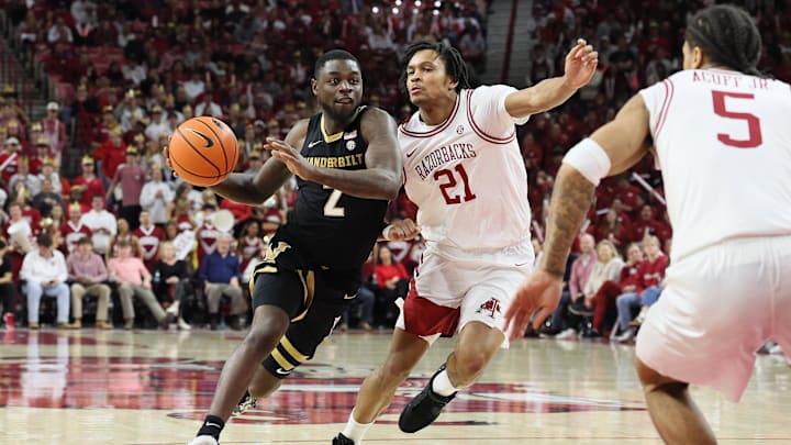 Jan 20, 2026; Fayetteville, Arkansas, USA; Vanderbilt Commodores guard Duke Miles (2) drives against Arkansas Razorbacks guard D.J. wagner (21) during the second half at Bud Walton Arena. Arkansas won 93-68. Mandatory Credit: Nelson Chenault-Imagn Images