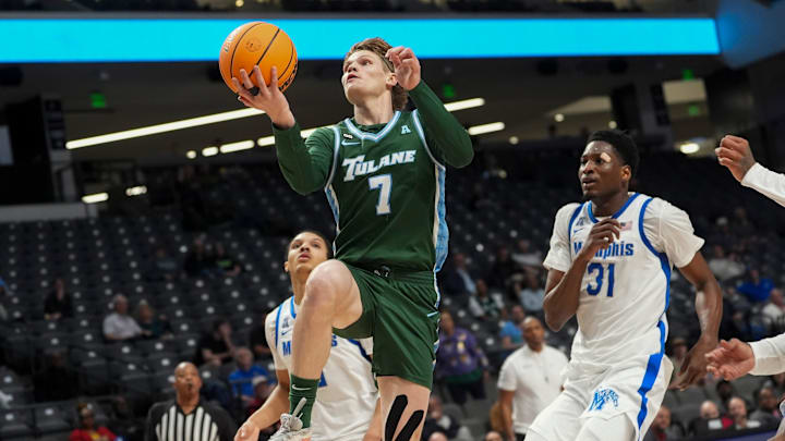 Tulane's Rowan Brumbaugh (7) goes for a layup during the first round American Conference Tournament game between Memphis and Tulane in Birmingham, Ala, on March 11, 2026.
