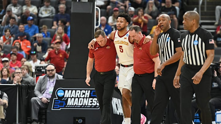 Mar 20, 2026; St. Louis, MO, USA; Iowa State Cyclones forward Joshua Jefferson (5) is helped off of the court after suffering an apparent injury to his left leg while shooting a layup against Tennessee State Tigers forward Jalen Pitre (not pictured) during the first half of a first round game of the men's 2026 NCAA Tournament at Enterprise Center. Mandatory Credit: Jeff Le-Imagn Images