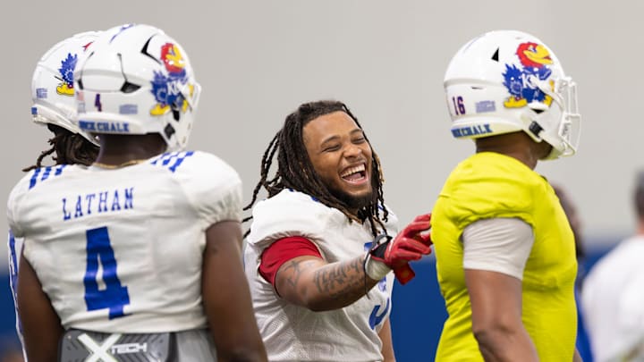 Kansas senior linebacker Joseph Sipp Jr. (3) laughs during Kansas Football Fan Appreciation Day Saturday, April. 5, 2025 at the Kansas Football Indoor Practice Facility in Lawrence, Kan.